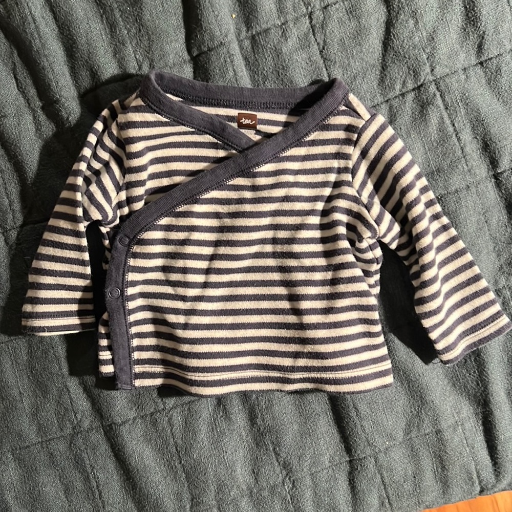 Navy and white stripe top with kimono style cross-body snap opening. EUC